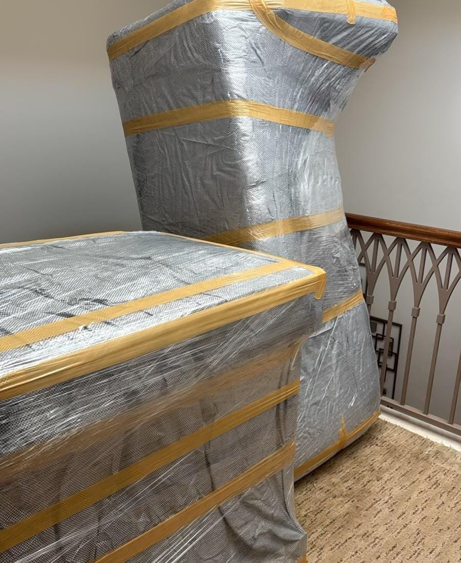 Wrapped furniture protected for moving on a staircase